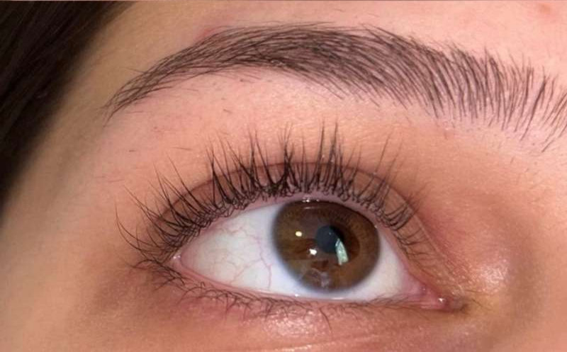 Close-up of a person's eye before and after eyelash extension application.